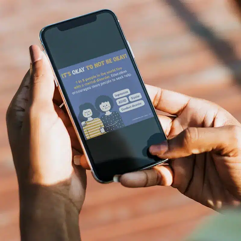 Example of internal health and safety campaigns for mental illness in the workplace with a digital campaign on a phone
