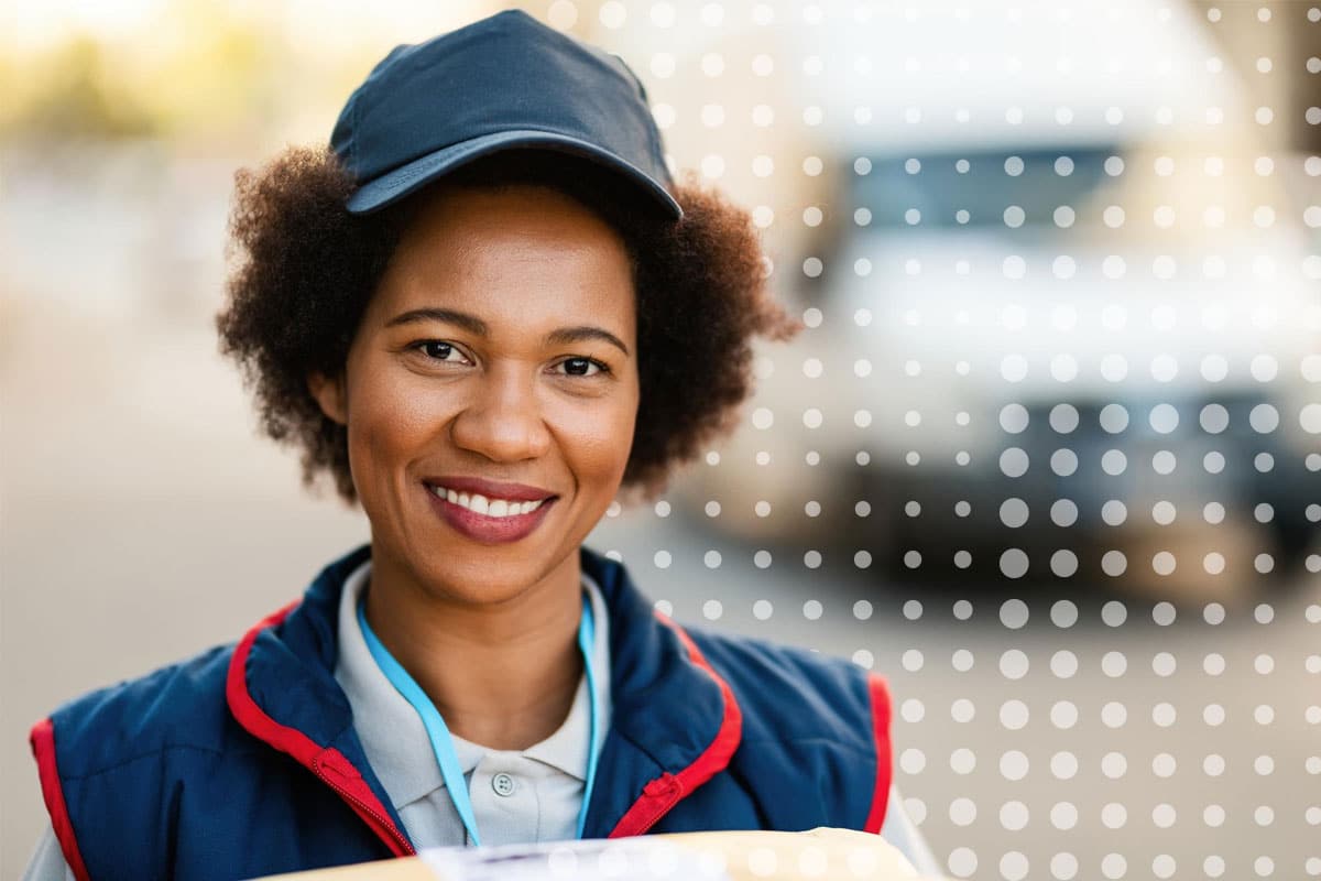 transport-logistics-internal-communications-with-commskit A middle-aged African-American woman wearing a logistics uniform representing and internal communications manager working with CommsKit