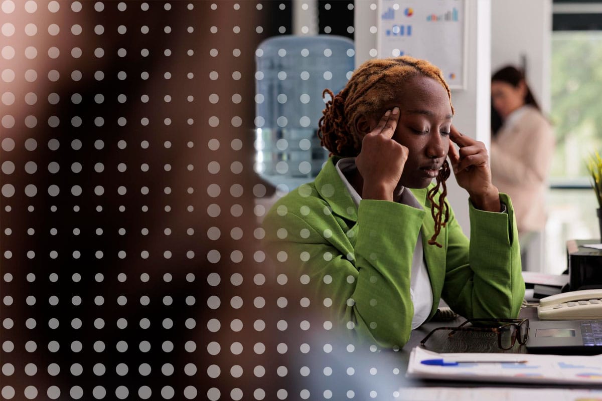 Woman at her desk, frustrated at why internal communications fail