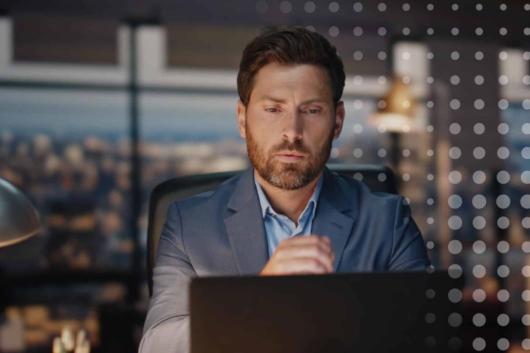 ai-discernment-in-business-communications-commskit-blog a businessman looking pensively at his article about AI discernment in business communications